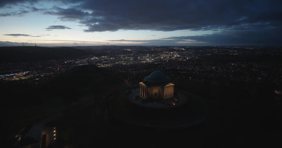 Aerial view of a classical building atop a hill in the city
