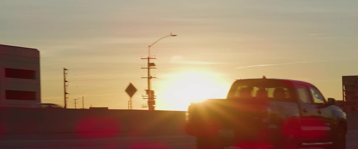 Traffic runs by the city in the morning
