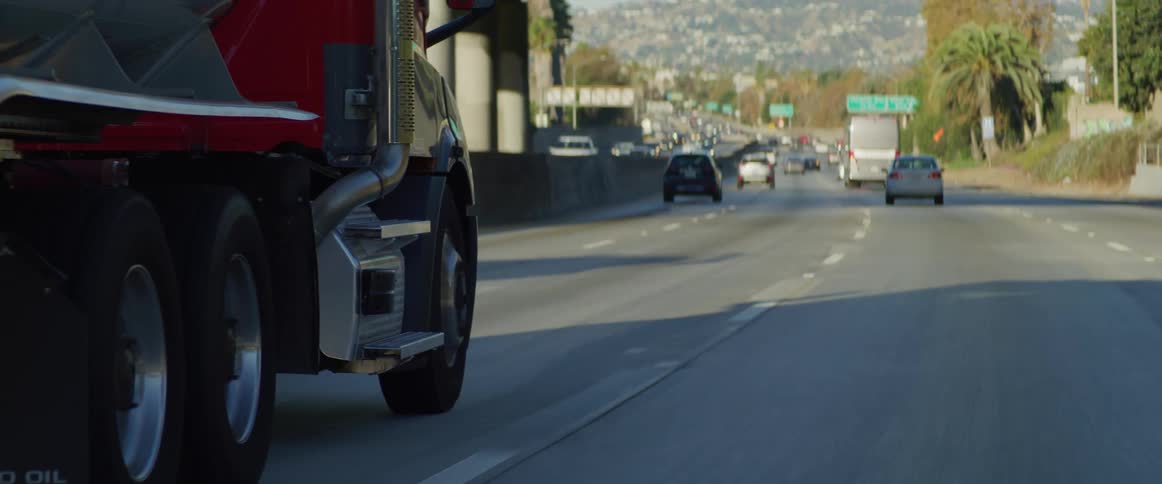 Wheels of a truck driving along the expressway