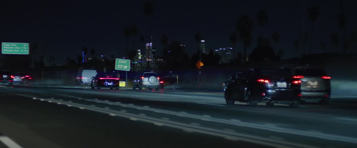 Traffic runs on the highway at night