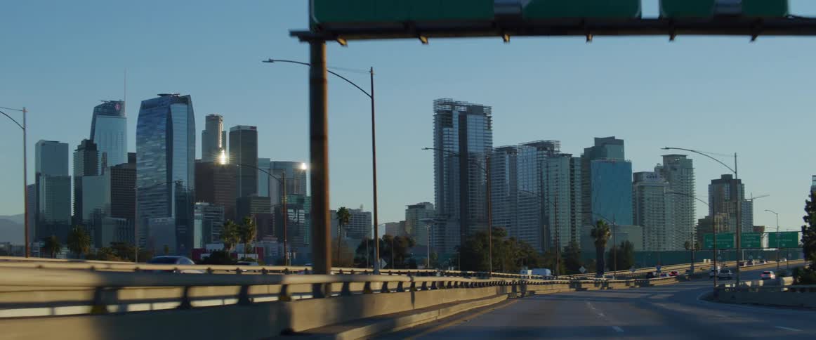 Skyline of los angeles seen from a moving vehicle at morning