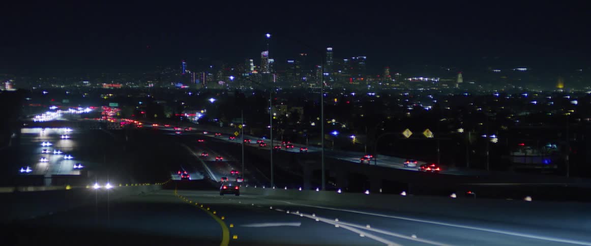 Traffic runs on the roads at night