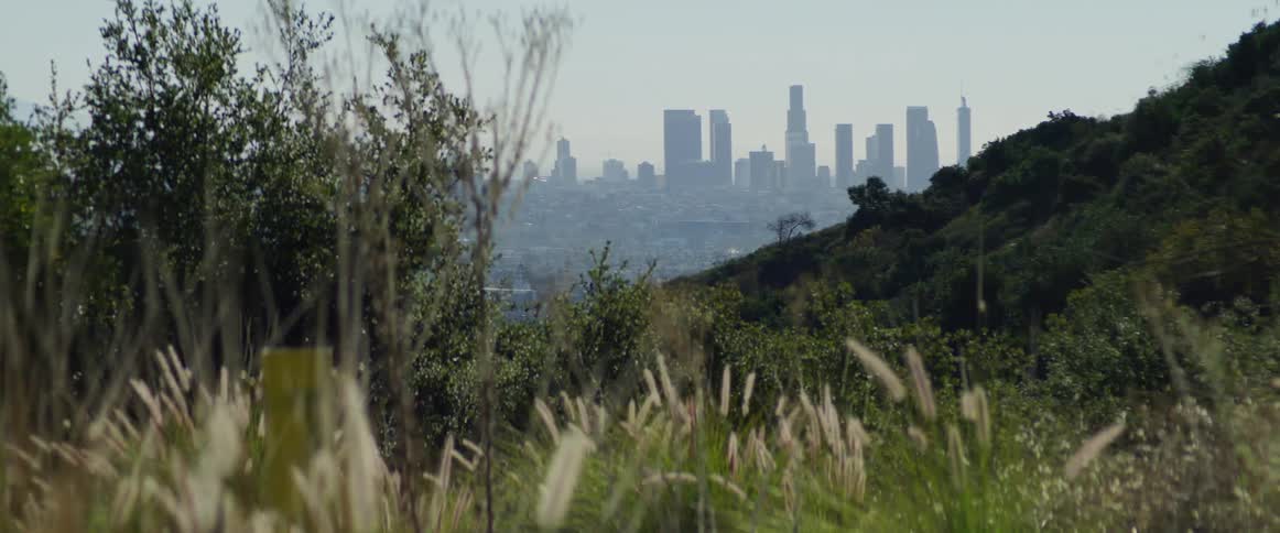 Hills are before the fog filled city
