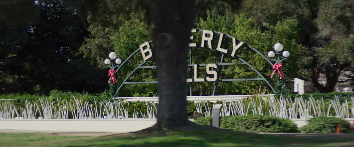 Beverly hills sign seen from a moving vehicle