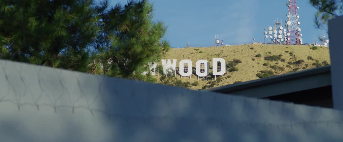 The iconic hollywood sign stands prominently on a hillside