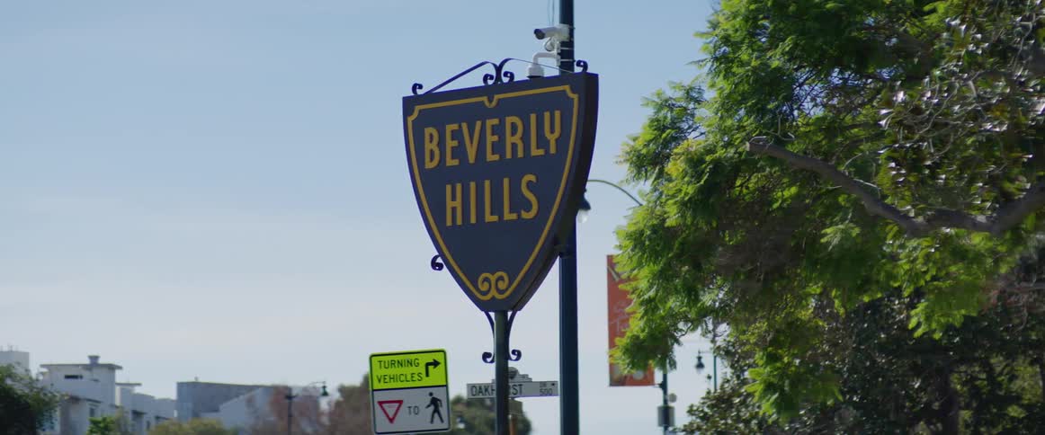 Beverly hills sign seen from a moving vehicle