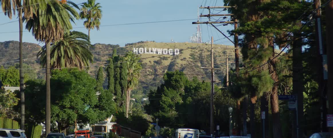 Hollywood sign on the hills seen from a moving vehicle