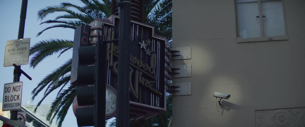 Signs on the side of a building in the city