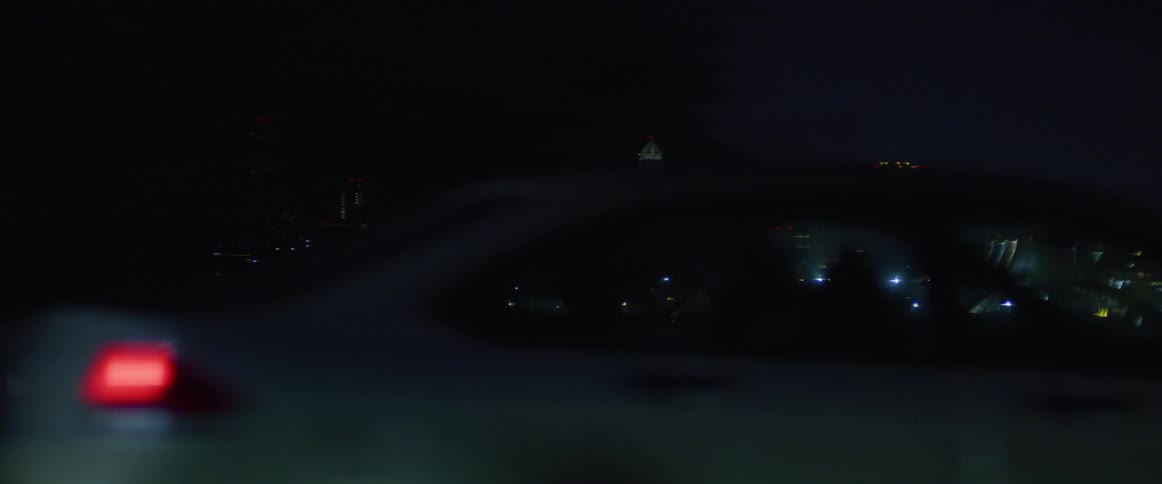 Traffic runs on the bridge near the city