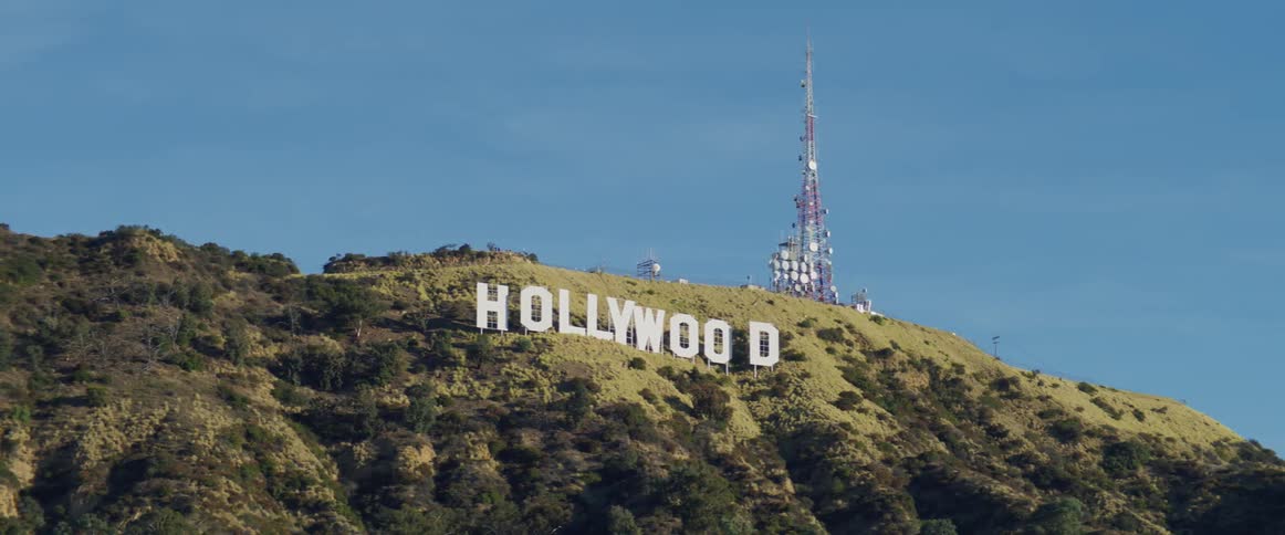 The hollywood sign is on the mountain