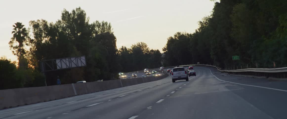 An expressway with heavy traffic during sunset