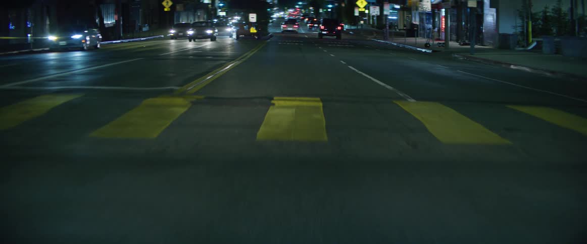 A busy city avenue at night