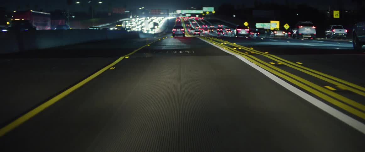 A highway with heavy traffic at night in the urban city
