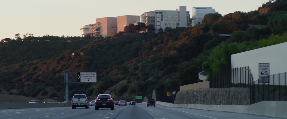 Traffic runs on the highway by the hill