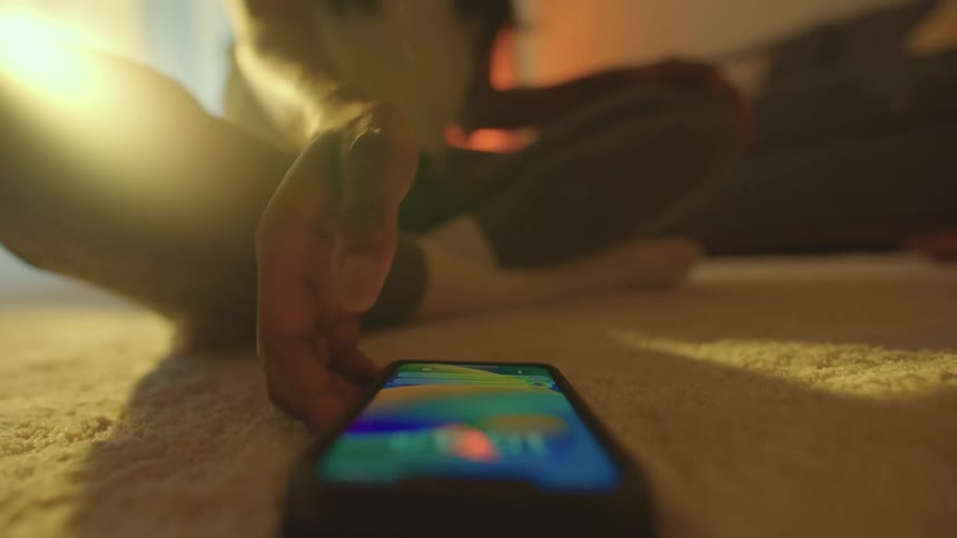 A woman answers her cell phone