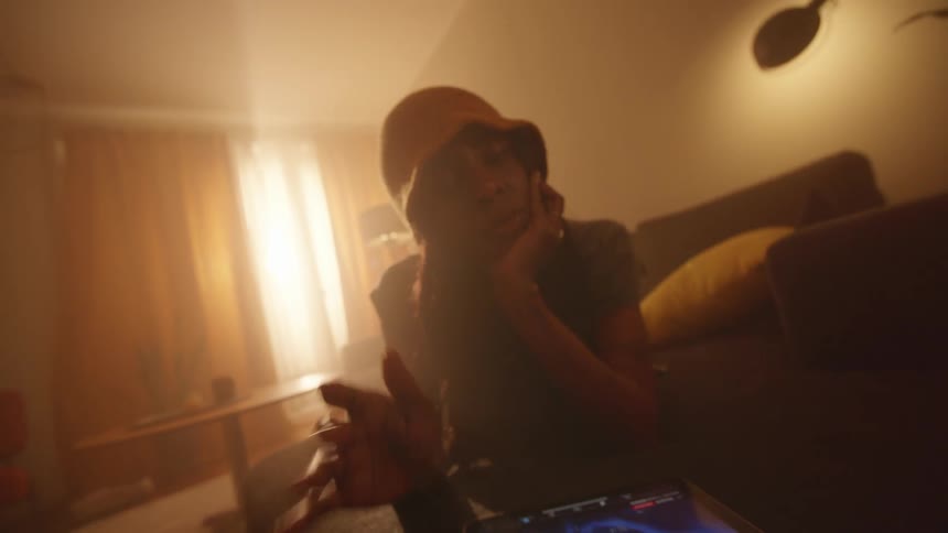 Bored woman using a tablet in the living room