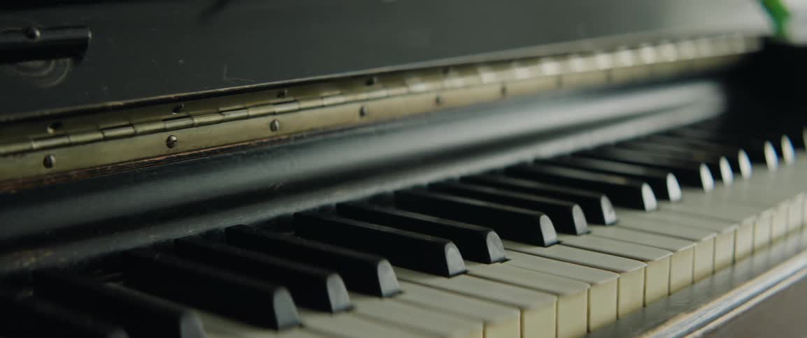 Light reflects on piano keys