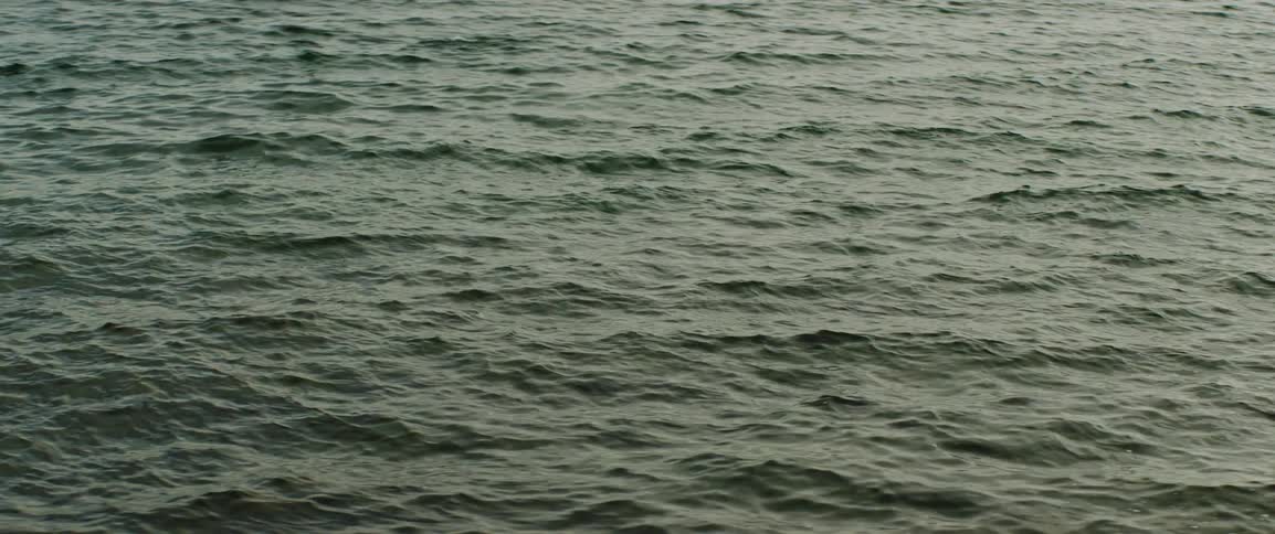 Waves roll across surface of ocean