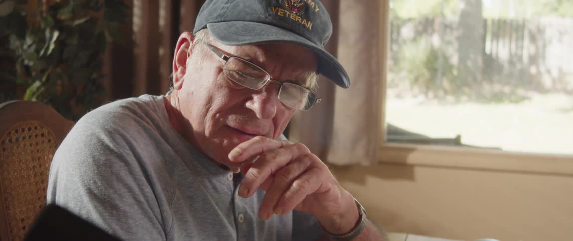 Close up of a elderly man reading documents at home