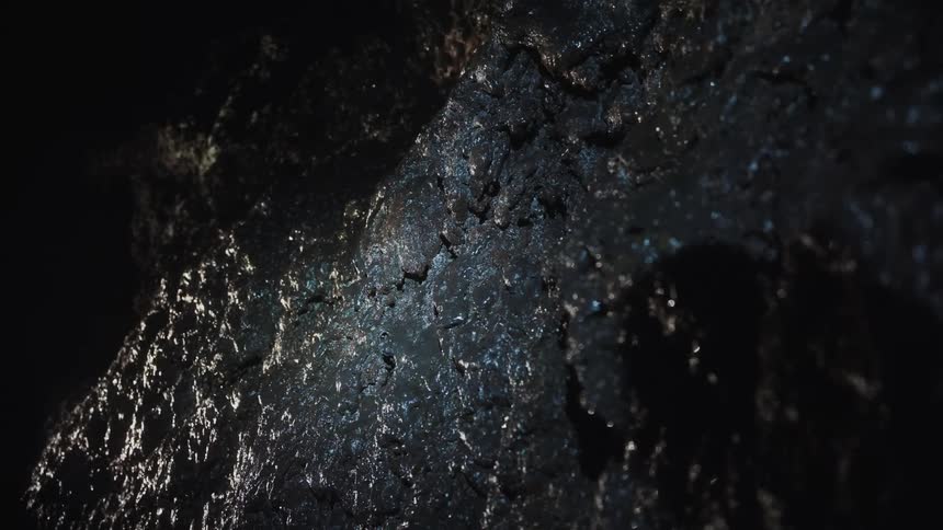 The cave rocks are wet