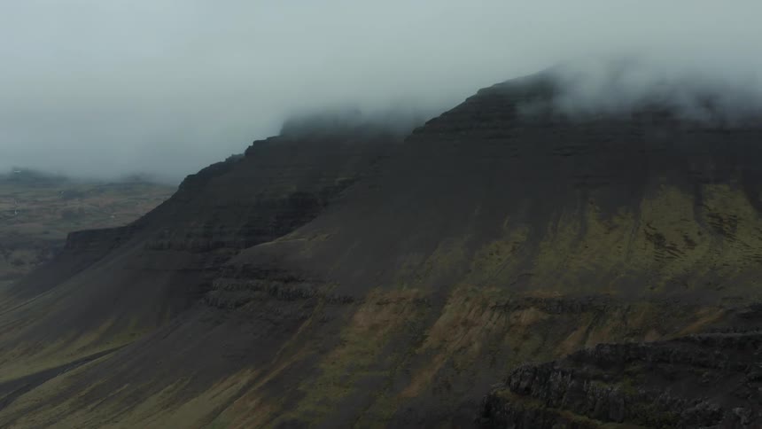 Clouds sit on top of the mountains