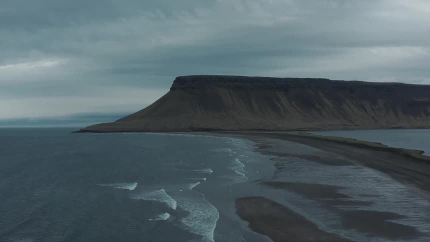 A mountain is on the beach