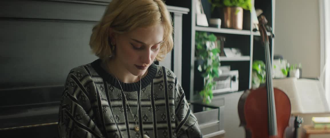 A woman writing on a tablet with a pen