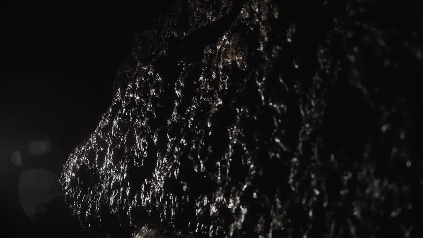 Water drips on the wet rock