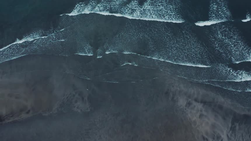 Waves move onto the shore