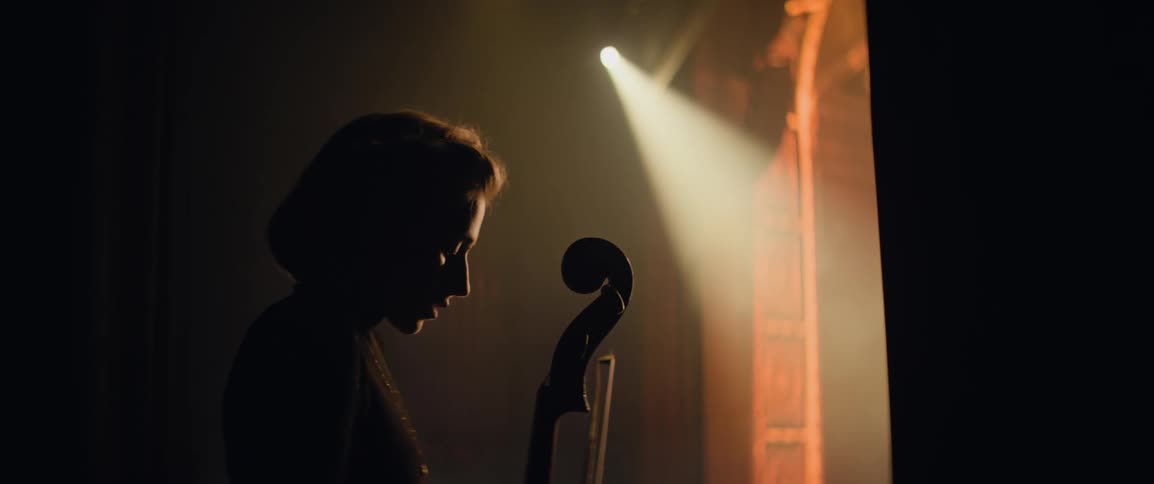 A nervous musician waiting just offstage before her big performance