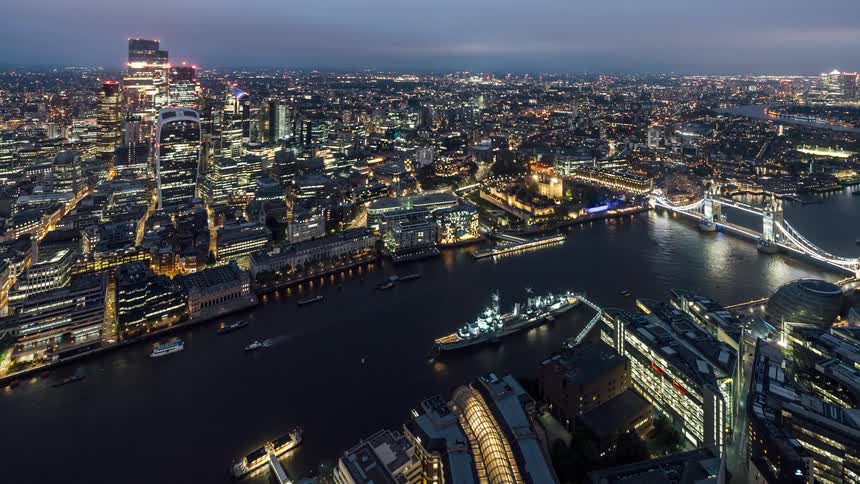 Aerial view of riverfront buildings and tower bridge