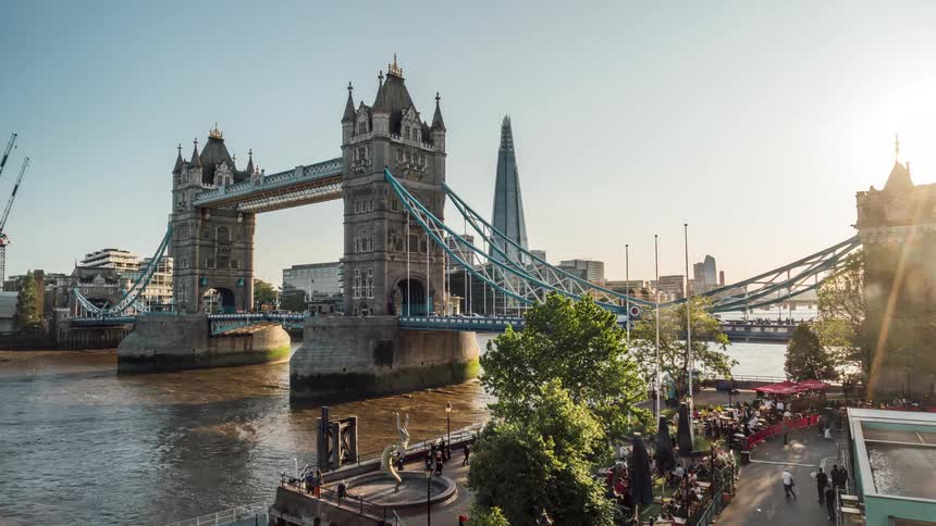 Tourists visiting the london bridge at sunset