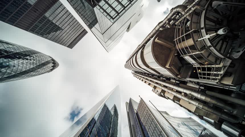 On mid day some skyscrapers is seen as the cloud moves in timelapse