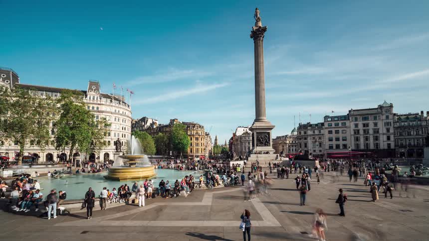 View of a square in the midst of a metropolis with thousands of people