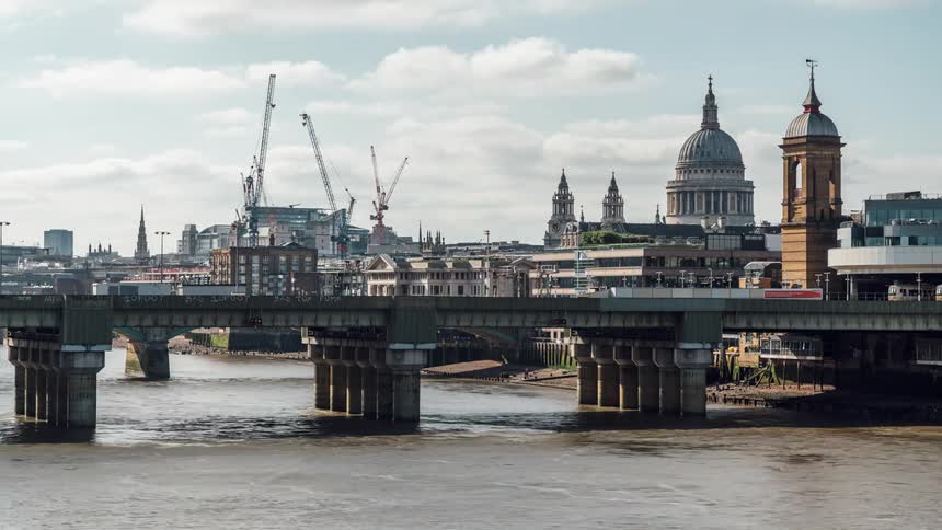 Series of boats moved pass under a bridge