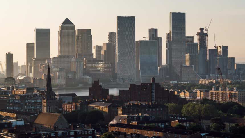 A city skyline view with lots of high rise building