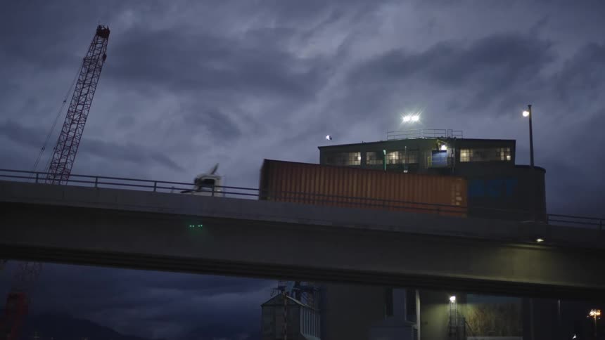 A truck passes on the overpass