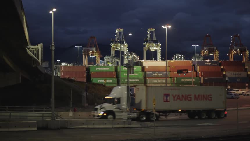 A clip of a truck transporting a cargo in the night