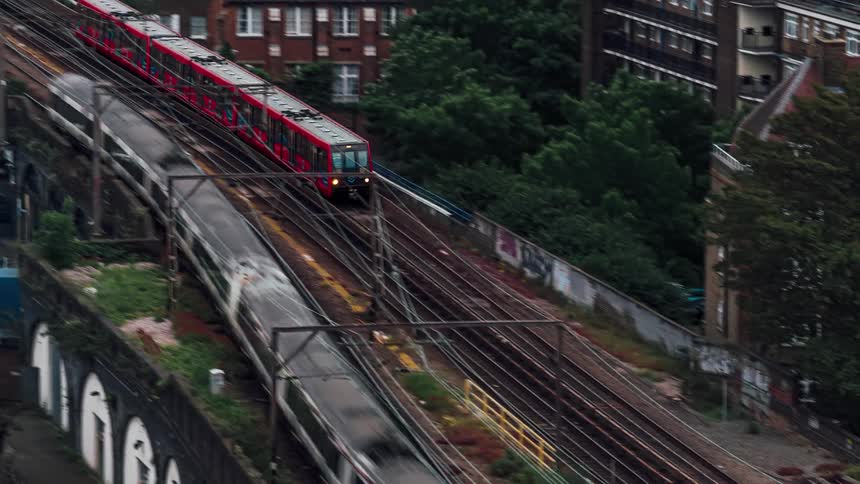 Trains travel on the overpass over the city