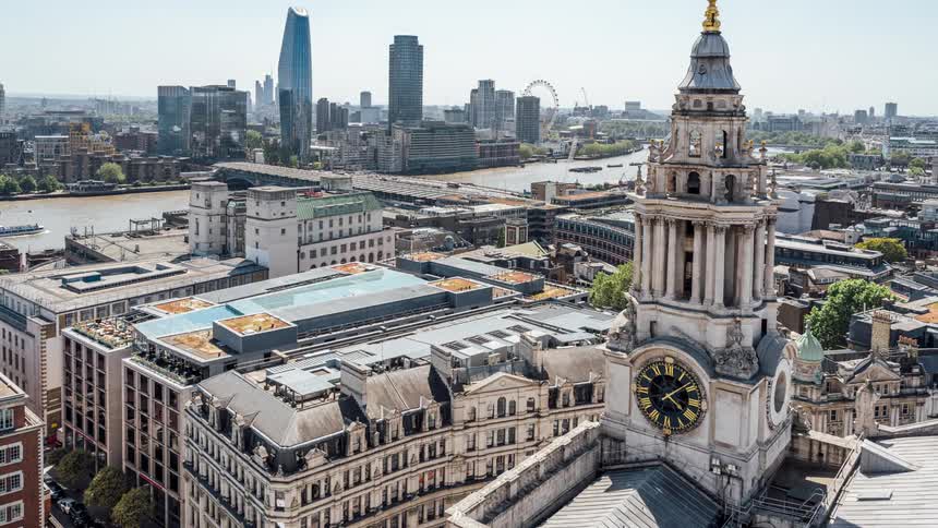 Clock tower in the modern city of london at daytime