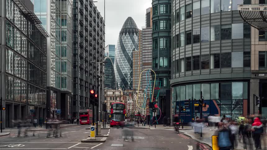 A busy street on timelapse as people and cars goes by