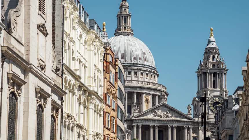 A street of classical buildings including one with a large dome