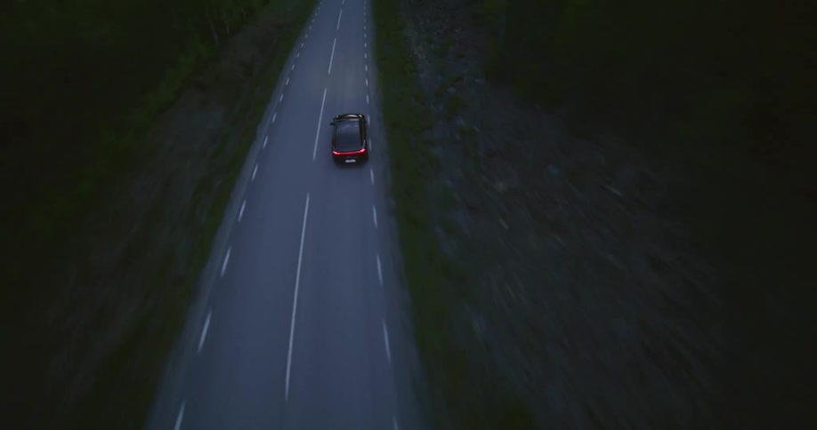 A car is racing down the highway