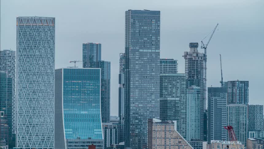 A region with several tall buildings in one night and the weather is dawning