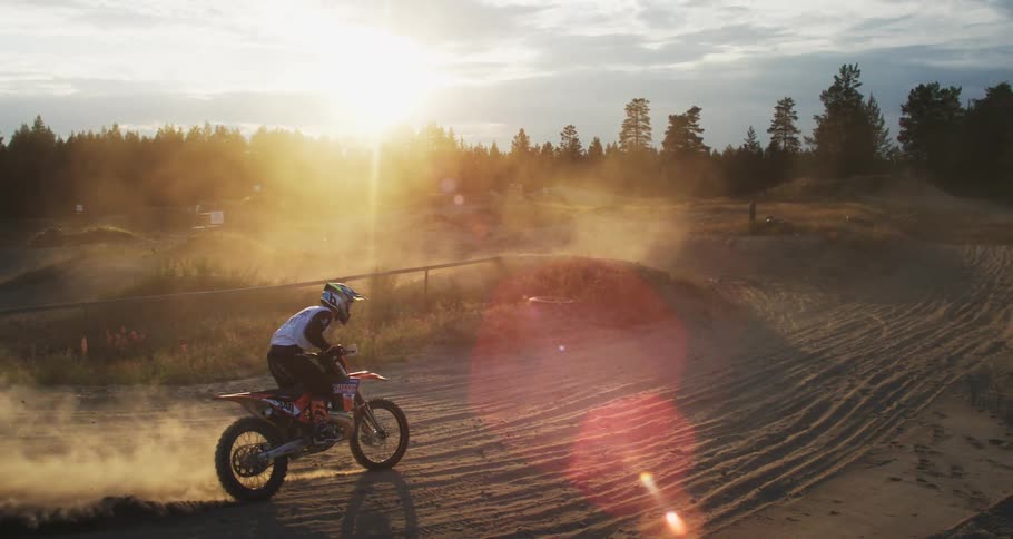 Man landing on a small motocross hill