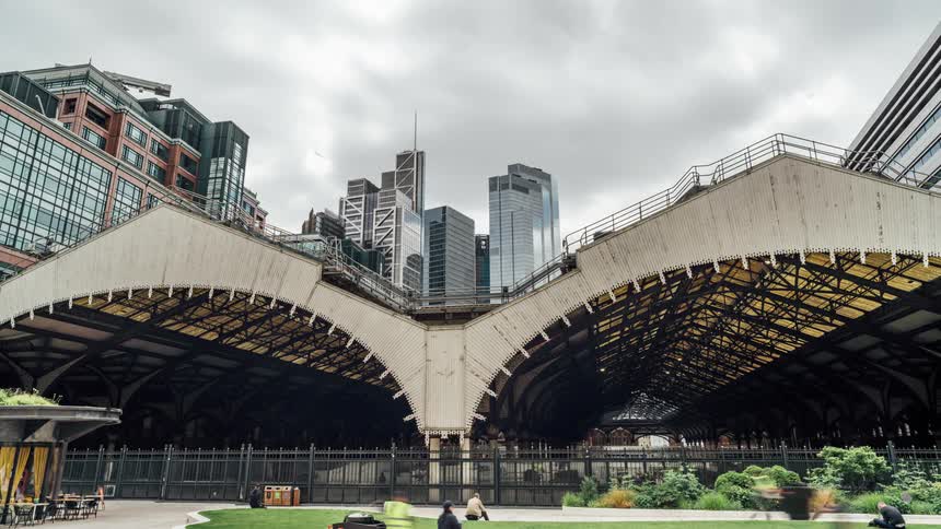 Pedestrians walk past the city all day