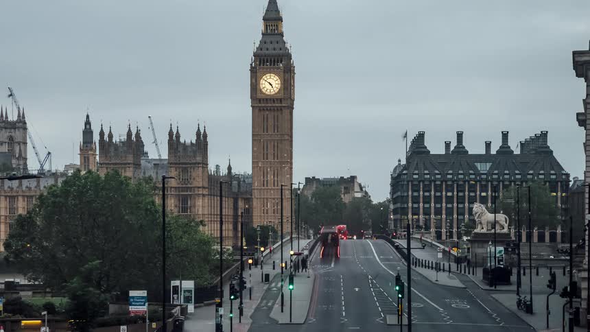 A time lapse show people and cars moving across a bridge in london