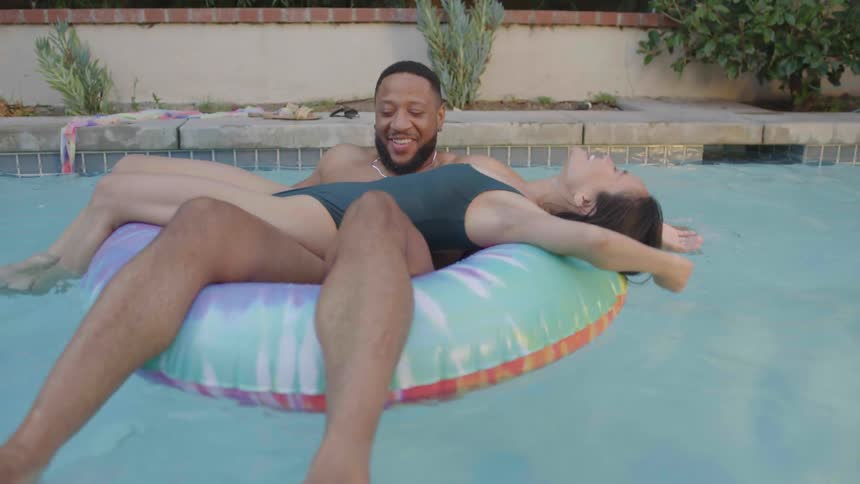 Young couple have fun together at the pool
