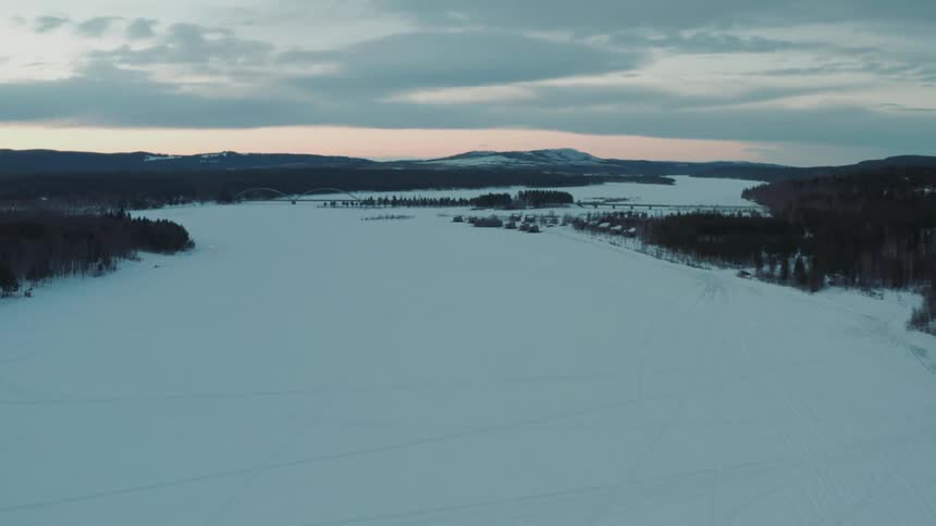 A frozen river covered in ice and snow