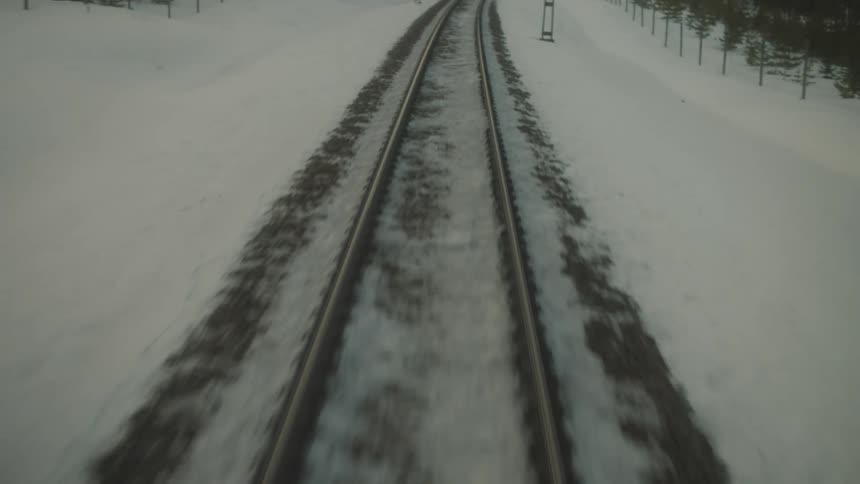 Train tracks are covered in snow during winter
